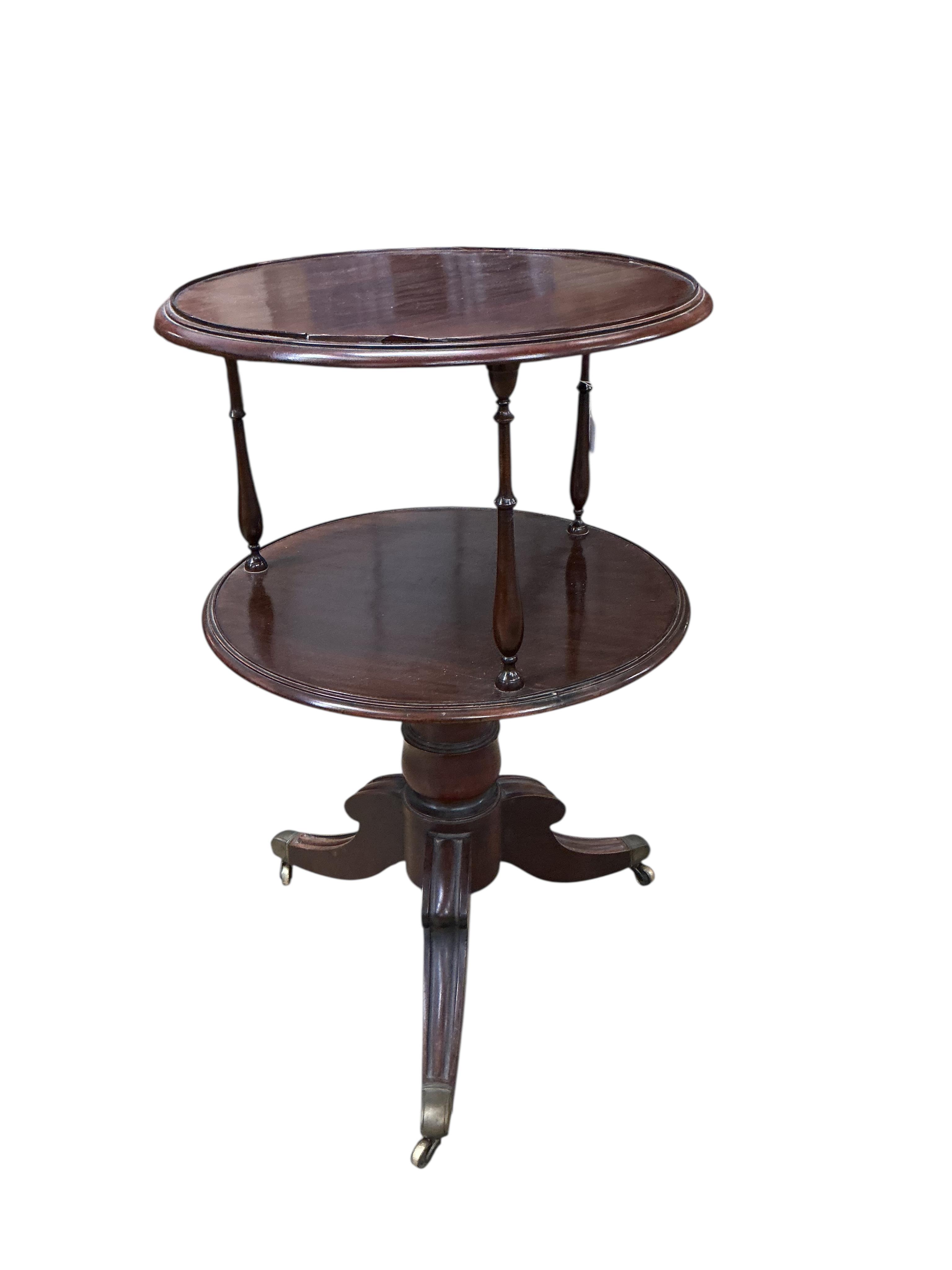 An early 20th century circular mahogany two tier whatnot, diameter 60cm, height 98cm